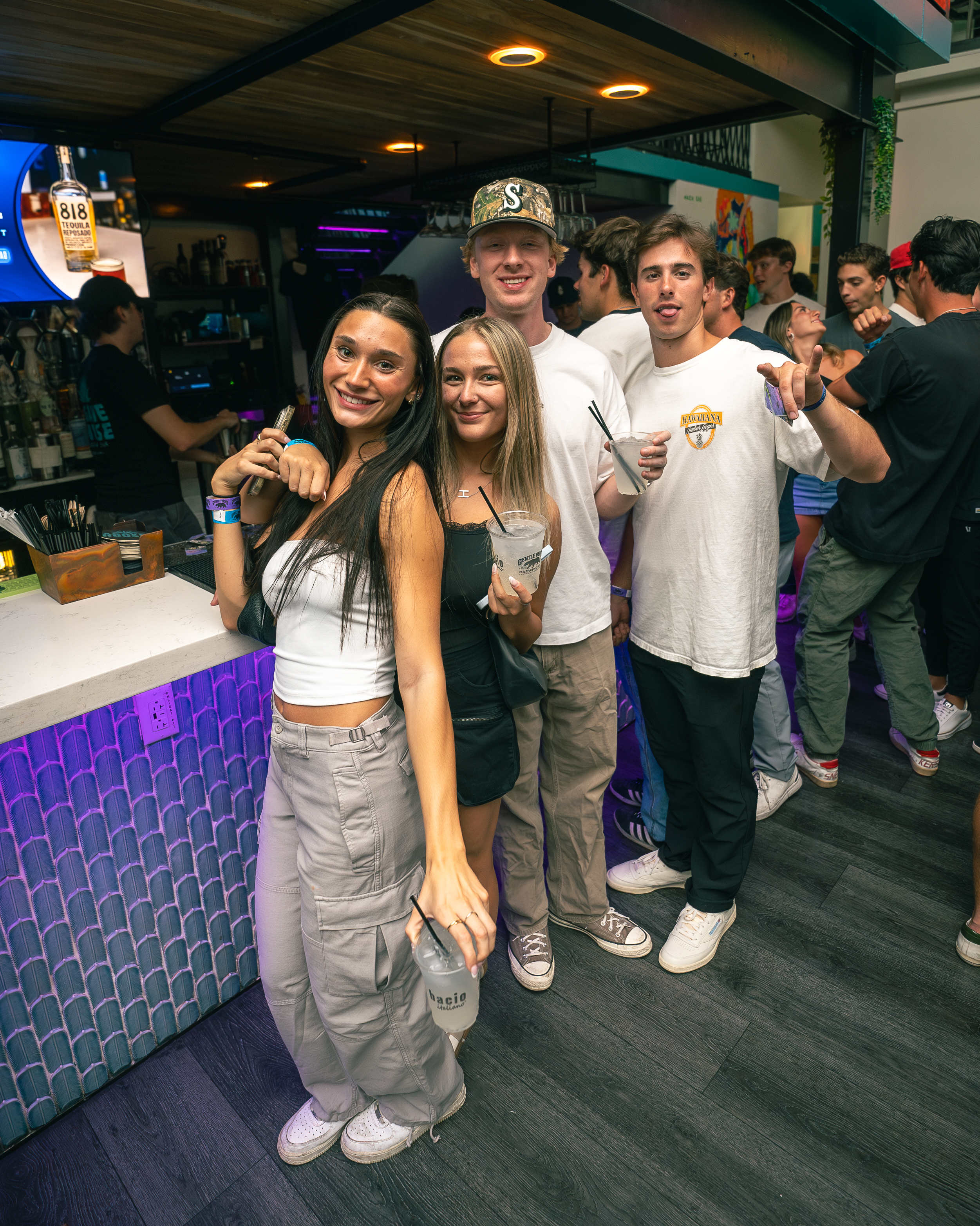 Damien Le Tallec et al. standing in front of a crowd posing for the camera